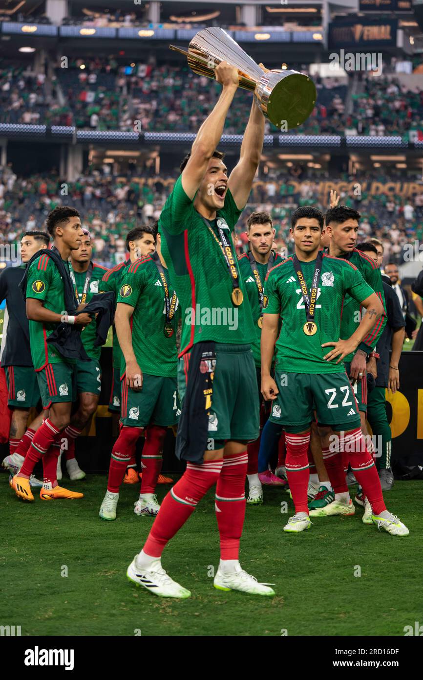 Mexico defender César Montes (3) readies the Gold Cup trophy after