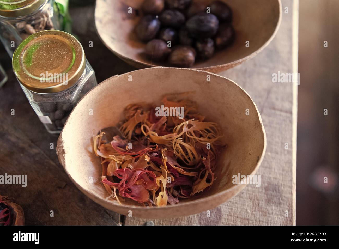 Nutmeg and mace spices. Organic mace in bowl. Mace spice crops. Whole