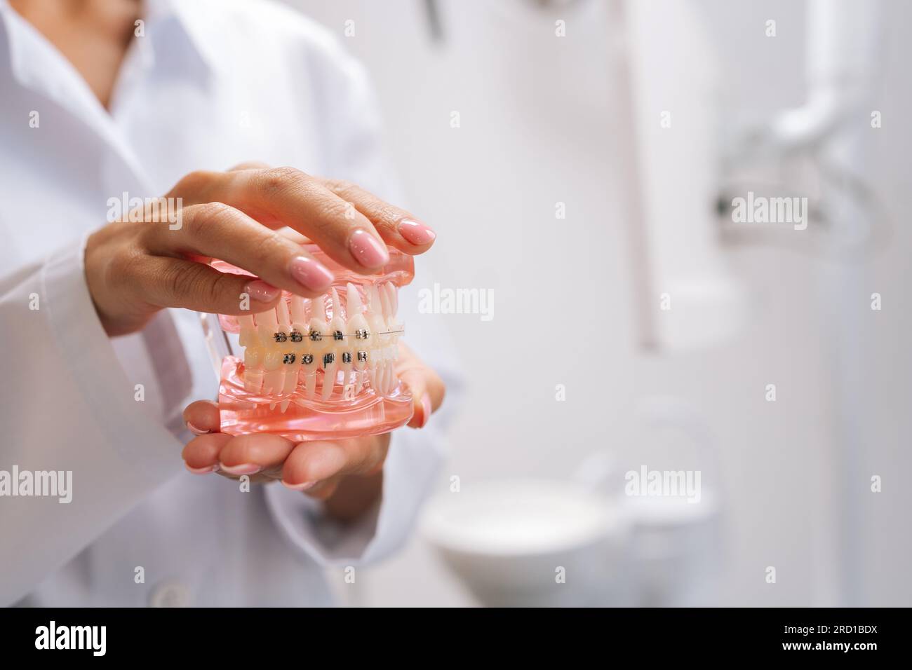Closeup cropped shot of unrecognizable female orthodontist doctor in ...