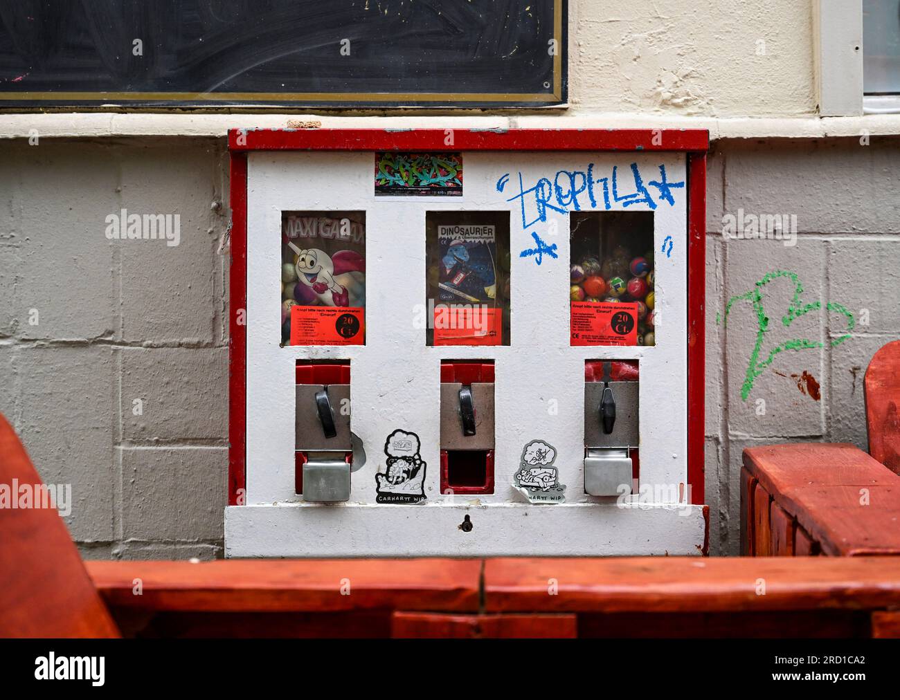 Berlin, Germany. 15th July, 2023. A chewing gum vending machine hangs