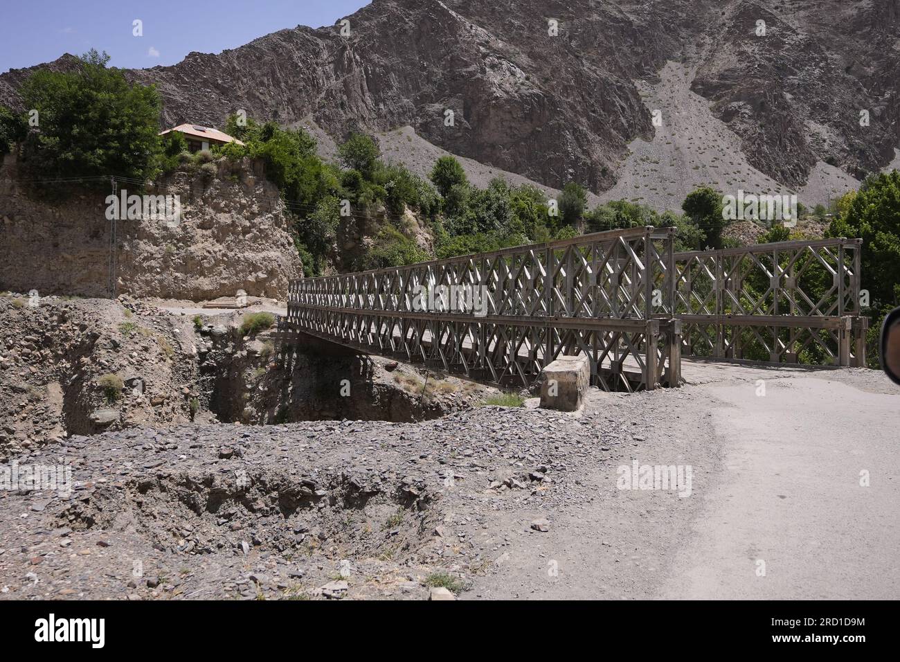 A bridge amongst the barren mountains Stock Photo