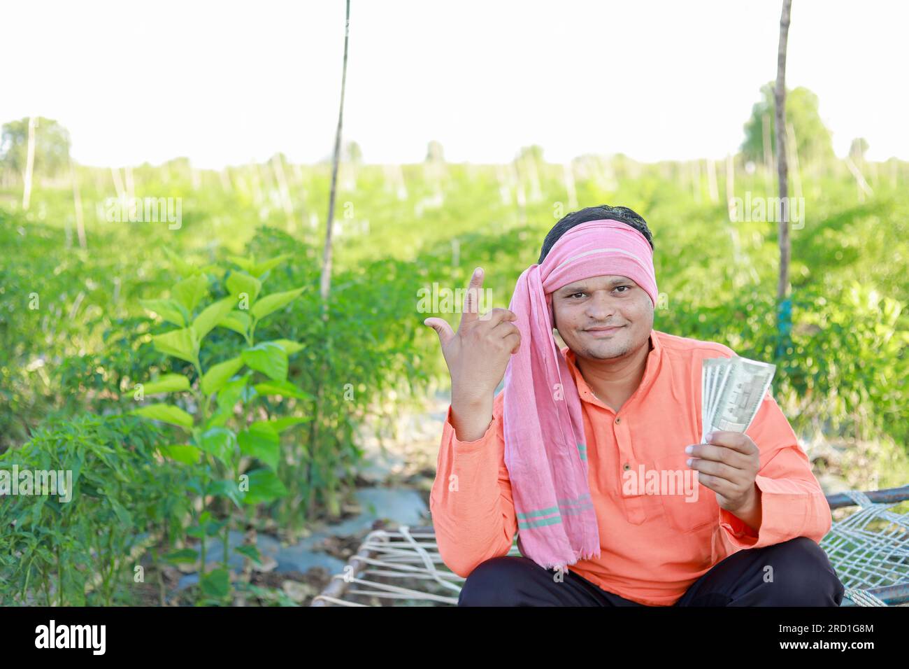 Happy Indian farmer, farmer holding indian rupees in hands, smart ...