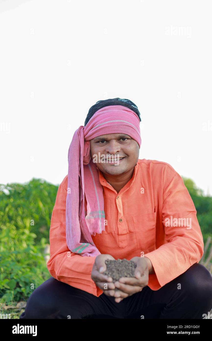 Happy Indian farmer, farmer holding soil in hands Stock Photo - Alamy