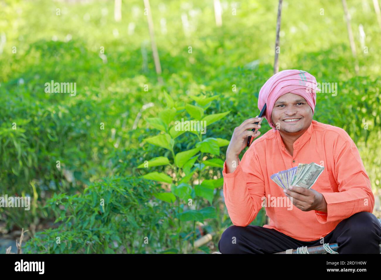 Happy Indian farmer, farmer holding indian rupees in hands, smart