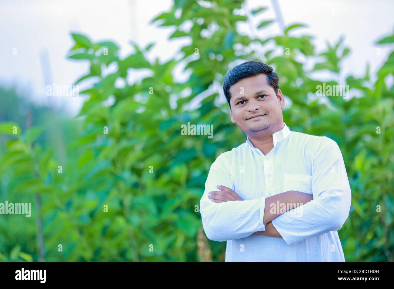 Happy Indian farmer, young farmer smiling in farm Stock Photo - Alamy