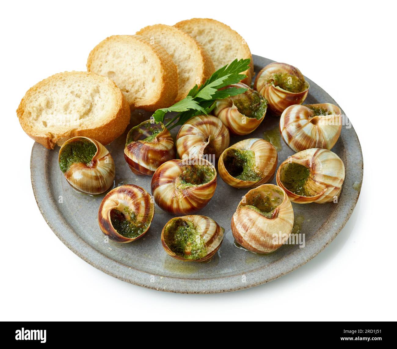 plate of baked escargot snails filled with parsley and garlic butter