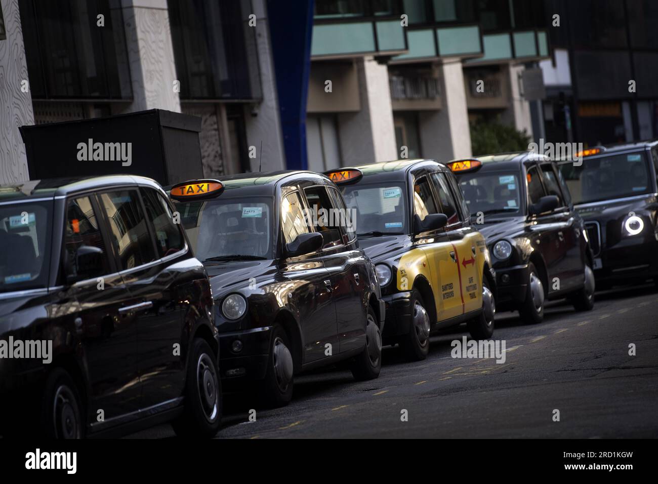 File photo dated 18/11/20 of a queue of black cabs outside Victoria Station, London. Taxi drivers could have to undergo training in disability awareness under new proposals aimed at improving the lives of disabled people. Making improvements in the courts system so more disabled people can be on juries, and bringing in a British Sign Language (BSL) GCSE are among other measures being considered as part of the Government's Disability Action Plan. Issue date: Tuesday July 18, 2023. Stock Photo
