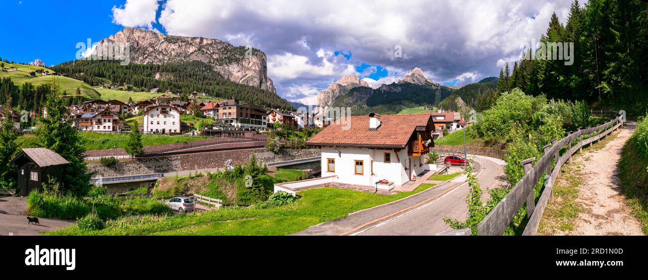 panorama of scenic  Val Gardena village ski resort in south Tyrol, surrounded by Alps mountains Dolomites,  northern Italy. Stock Photo
