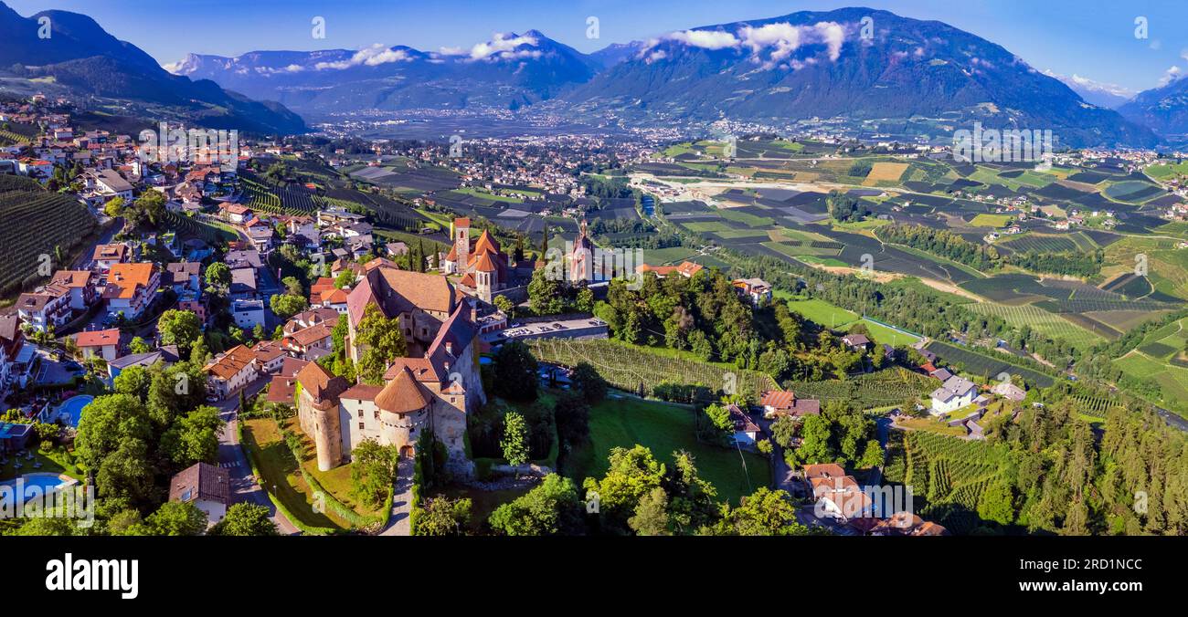 Tourism of northen Italy.  Traditional picturesque mountain village Schenna (Scena) near Merano town in Trentino - Alto Adige region. aerial drone hig Stock Photo