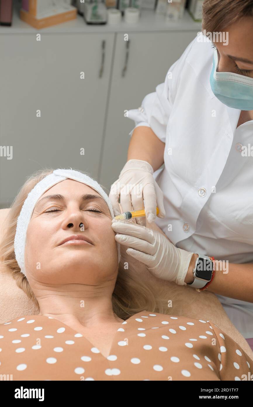 Face treatments. The concept of maintaining health, youth and beauty. Modern cosmetology, beautician tools. Beauty techniques. Facial mesotherapy. Stock Photo