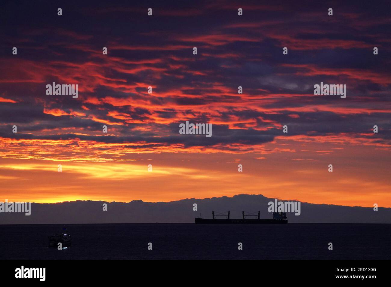 A cargo ship sits on the horizon on the North Sea near Tynemouth prior ...