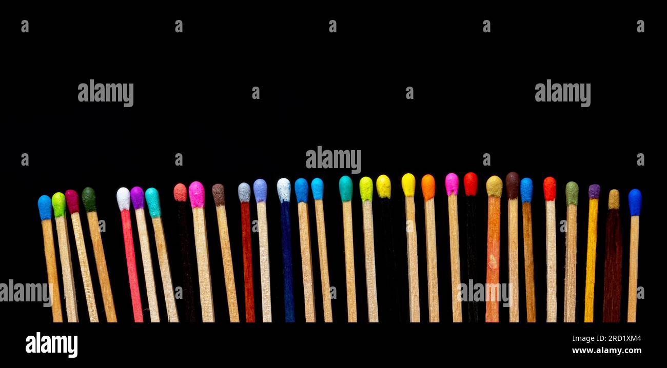 matchsticks of various shapes and colors on black background Stock Photo