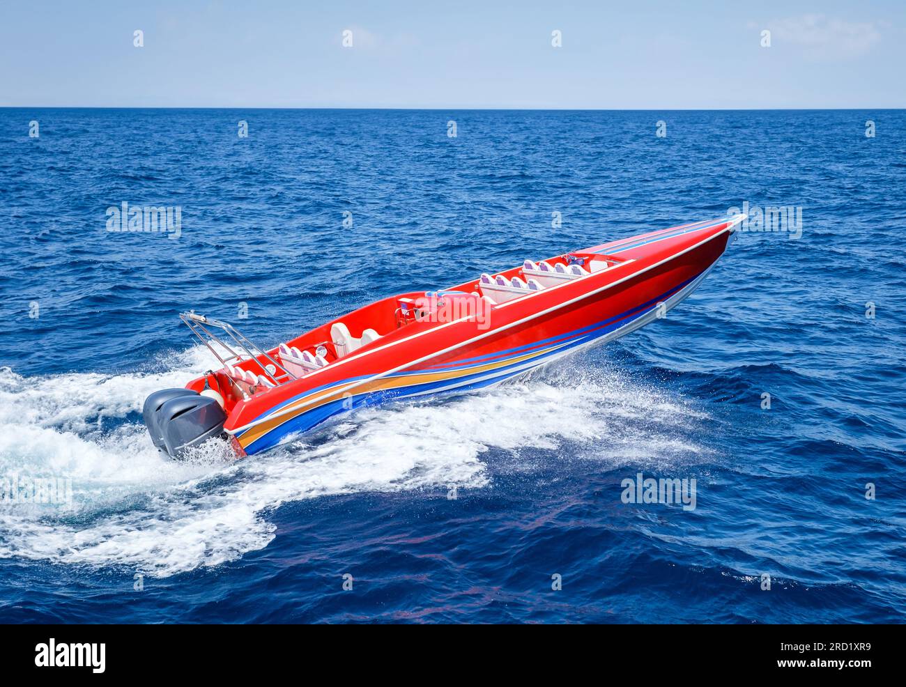 Red speed powerboat on blue water Stock Photo - Alamy