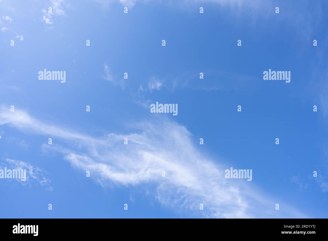 Blue sky and white cirrocumulus clouds texture background. Blue sky on sunny day. Summer sky. Cloud formation. Fluffy clouds. Nice weather in summer Stock Photo