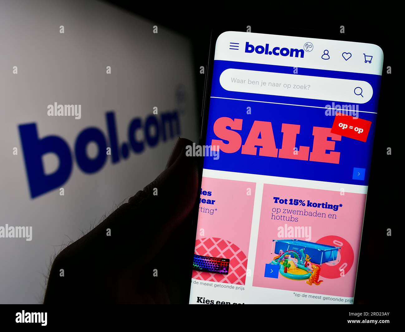 Person holding smartphone with webpage of Dutch e-commerce company bol.com  B.V. on screen in front of logo. Focus on center of phone display Stock  Photo - Alamy