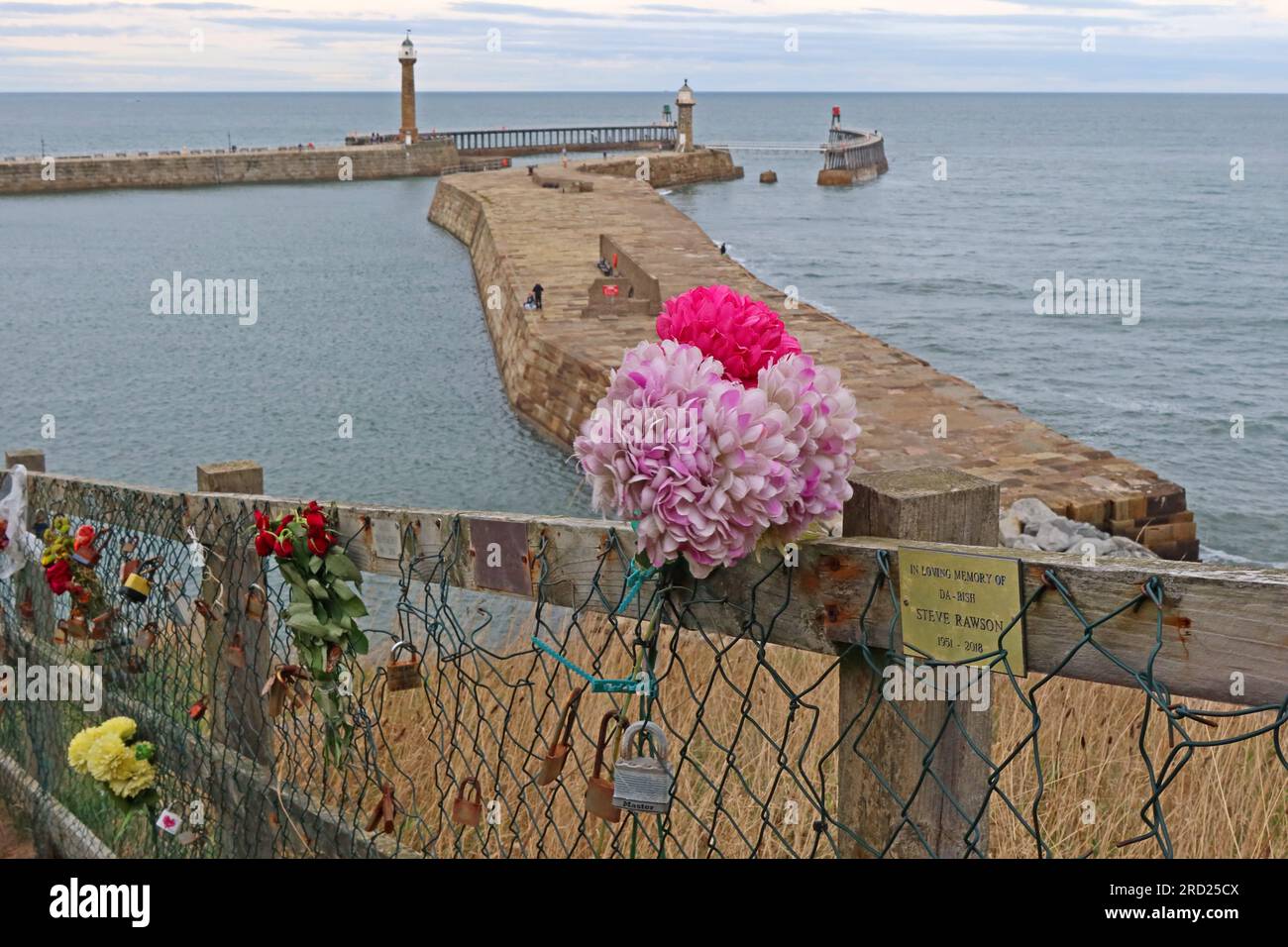 From the Haggerlythe, Whitby pier & harbour, memorials, lovelocks and flowers, in North Yorkshire, England, UK, YO22 4DW Stock Photo