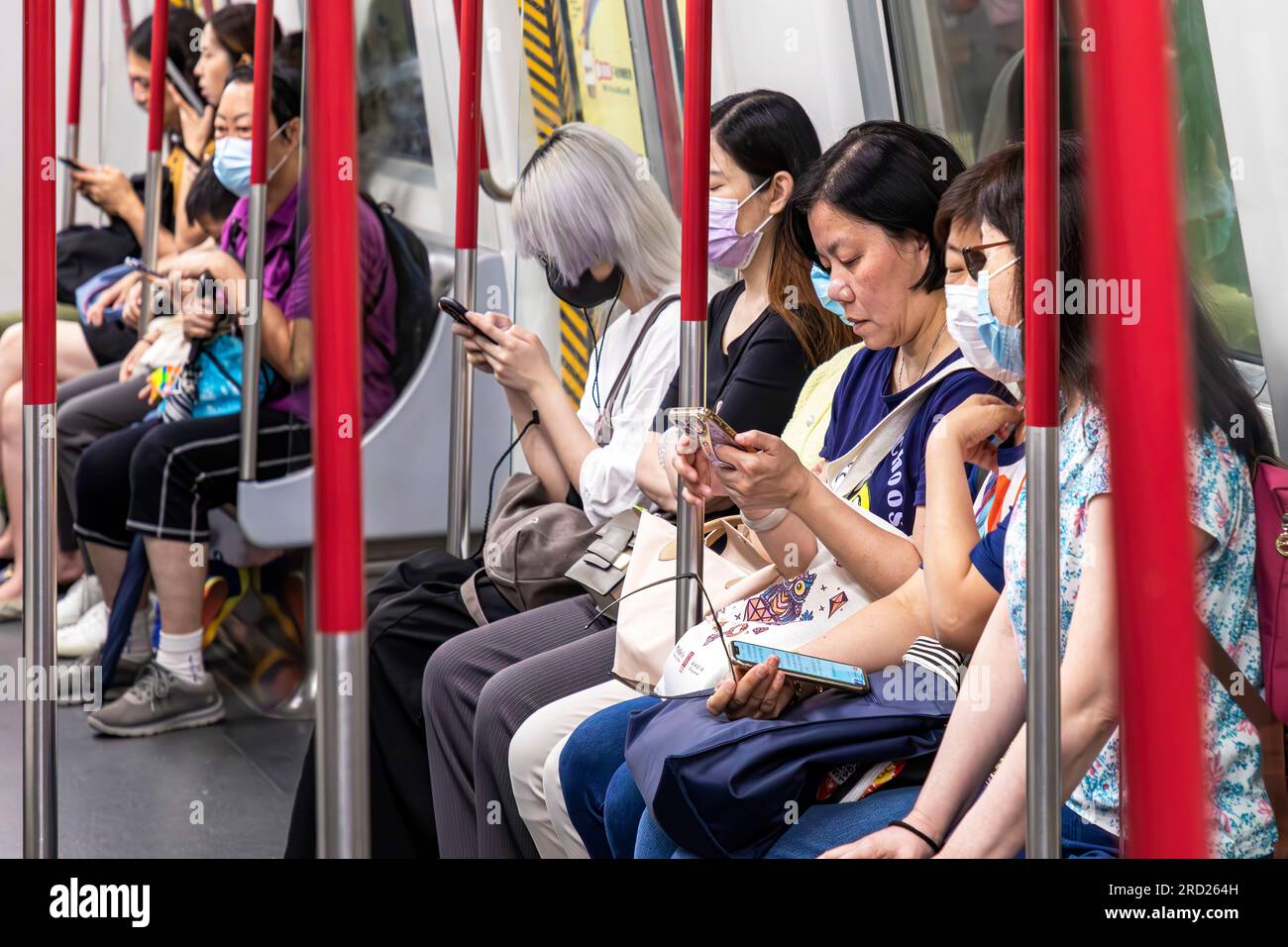 Passengers on MTR rapid transit train, Hong Kong, SAR, China Stock Photo