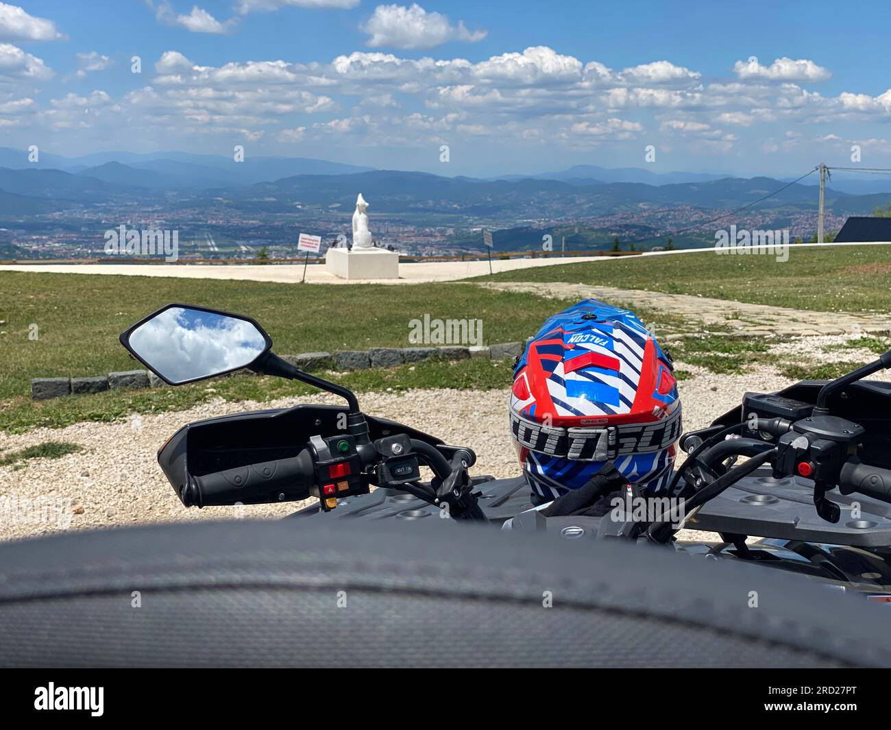 Ready for Action Blue and Red Helmet on ATV Quad backside view Stock