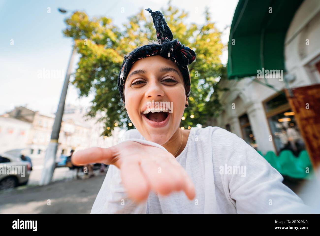 Young girl inviting with a hand taking Stock Photo - Alamy