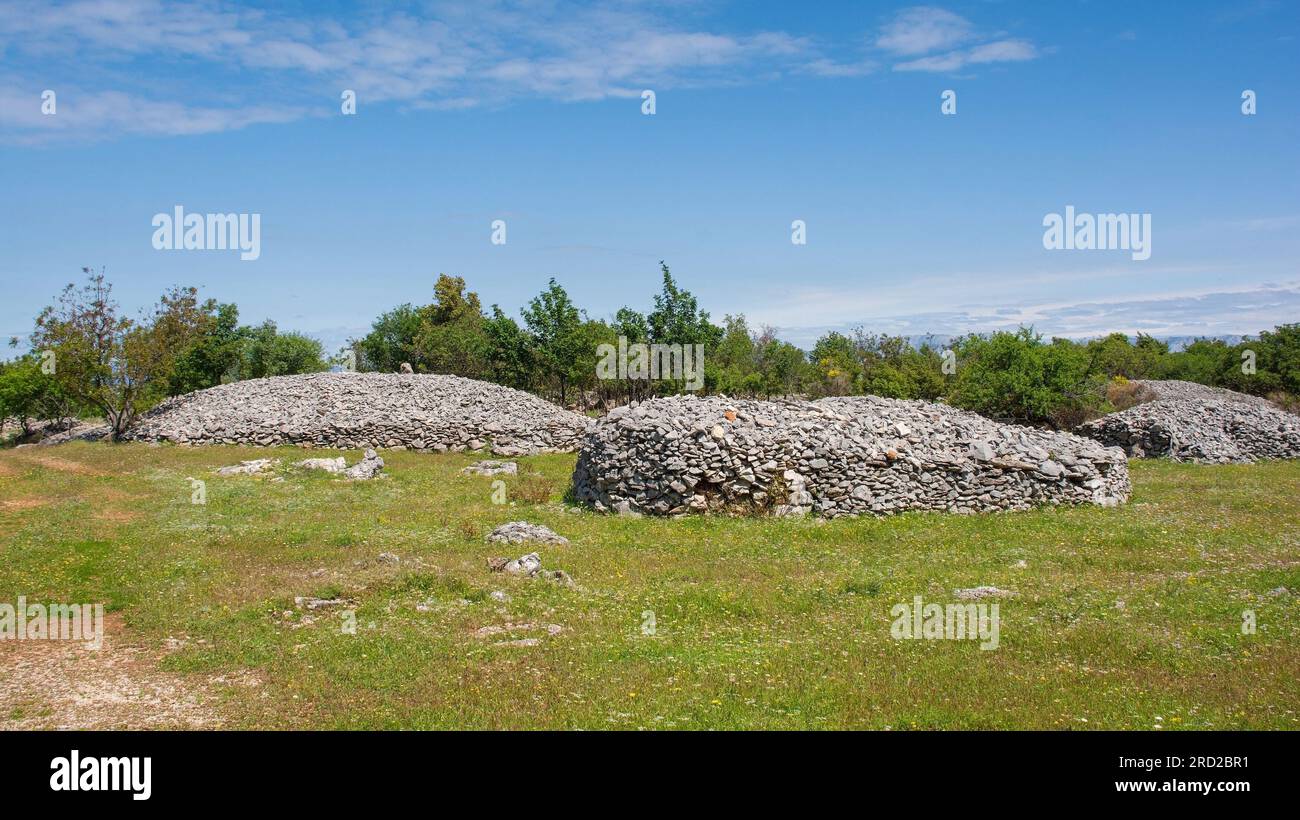 The spring landscape near Nerezisca on Brac Island in Croatia in May, showing the island's characteristic stone mounds and walls Stock Photo