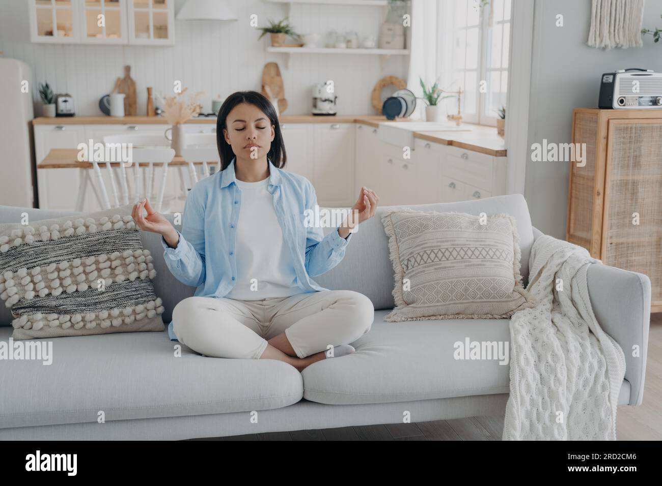 Zen, tranquility and breath control. Spanish woman is practicing yoga