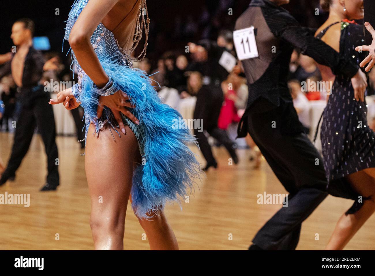 female dancer in blue dress in dancesport competition, latino dance Stock Photo