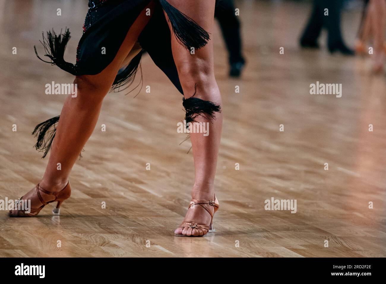feet female dancer in brown dancing shoes, dancesport competition, pasodoble dance Stock Photo