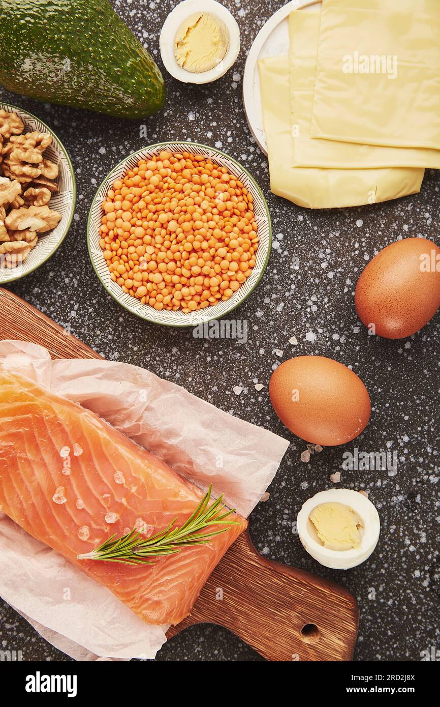 Smoked salmon, cheese, avocado, eggs, lentils, walnuts. Natural proteins. Ingredients for preparing food. Healthy lifestyle. Top view. Stock Photo