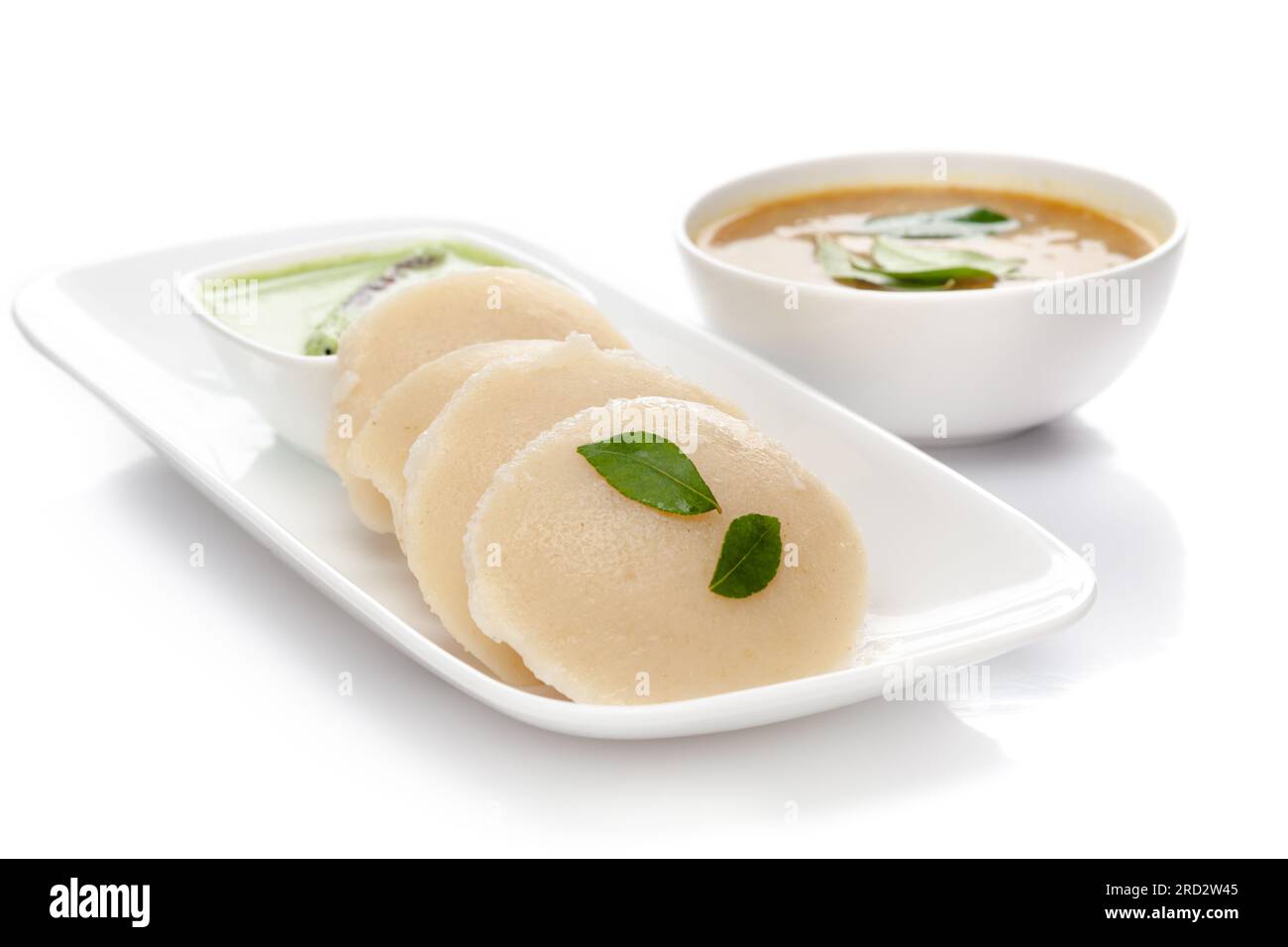 Close-up of Idli Sambhar or Idly Sambar is a popular south Indian food, served with coconut chutney. selective focus Stock Photo