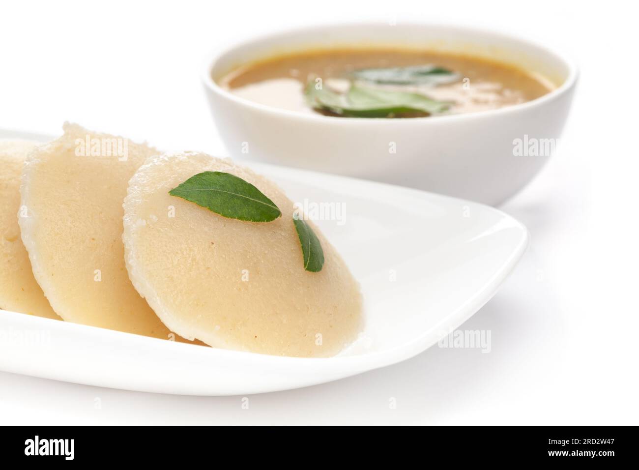 Close-up of Idli Sambhar or Idly Sambar is a popular south Indian food, served with coconut chutney. selective focus Stock Photo
