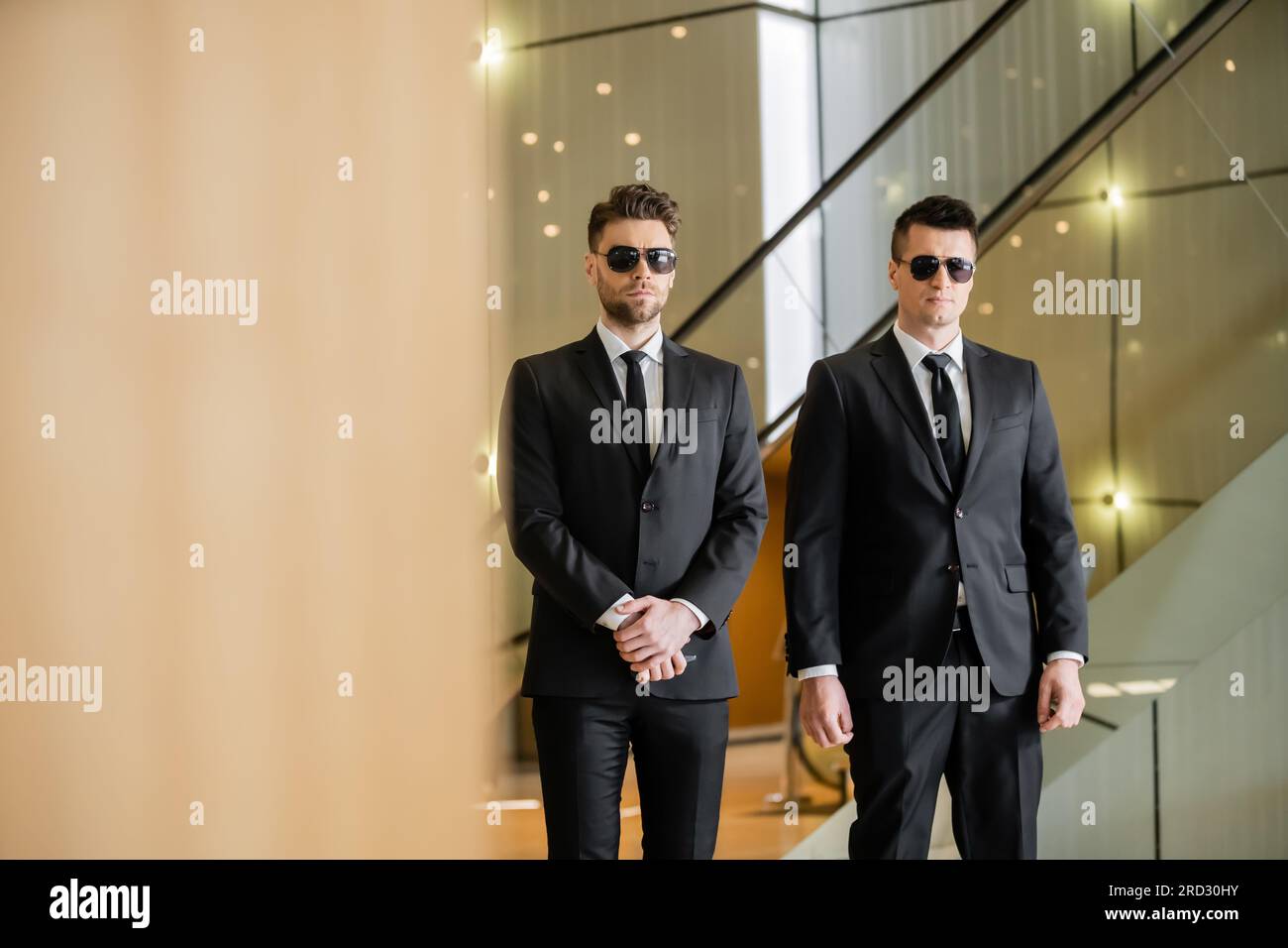 security guards, two handsome men in formal wear and sunglasses