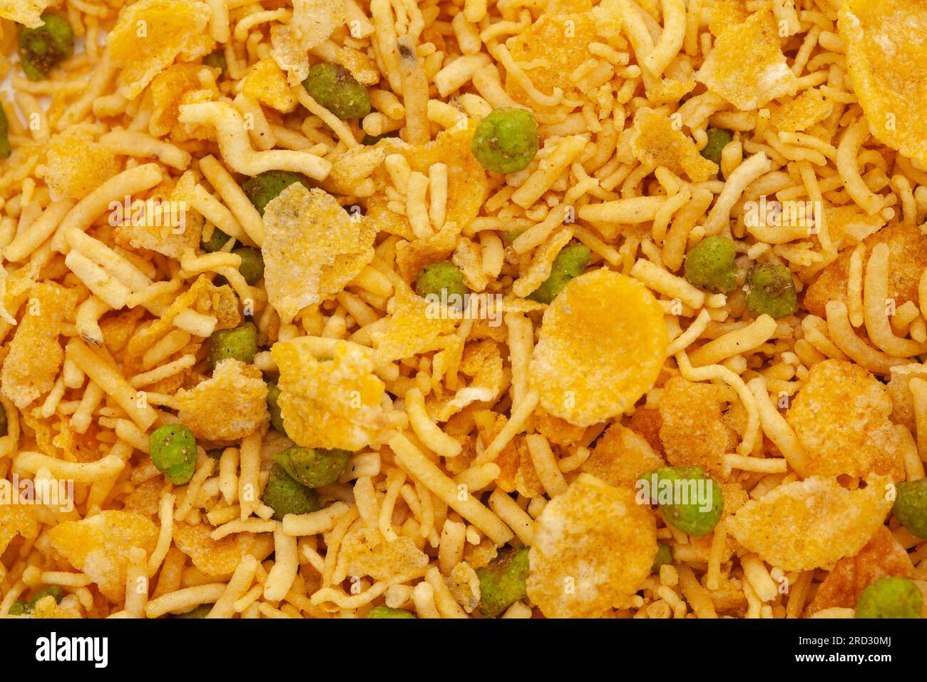 Crunchy Diet Mixture full-frame wallpaper, made with Puffed Rice, Corn Flakes, and Curry leaves. Indian spicy snacks (Namkeen) Stock Photo