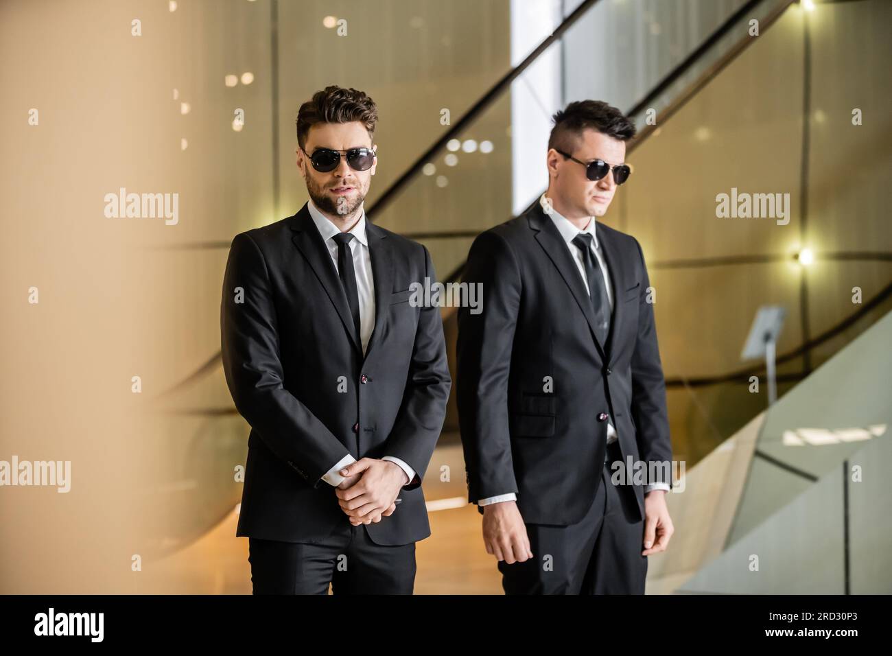 security management of luxury hotel, two handsome men in formal wear
