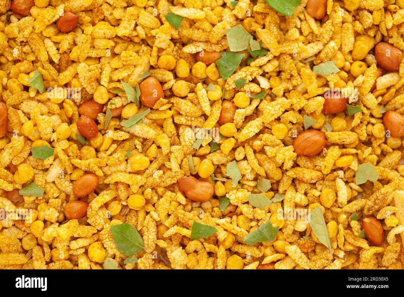 Crunchy Diet Mixture full-frame wallpaper, made with Puffed Rice, Corn Flakes, and Curry leaves. Indian spicy snacks (Namkeen) Stock Photo
