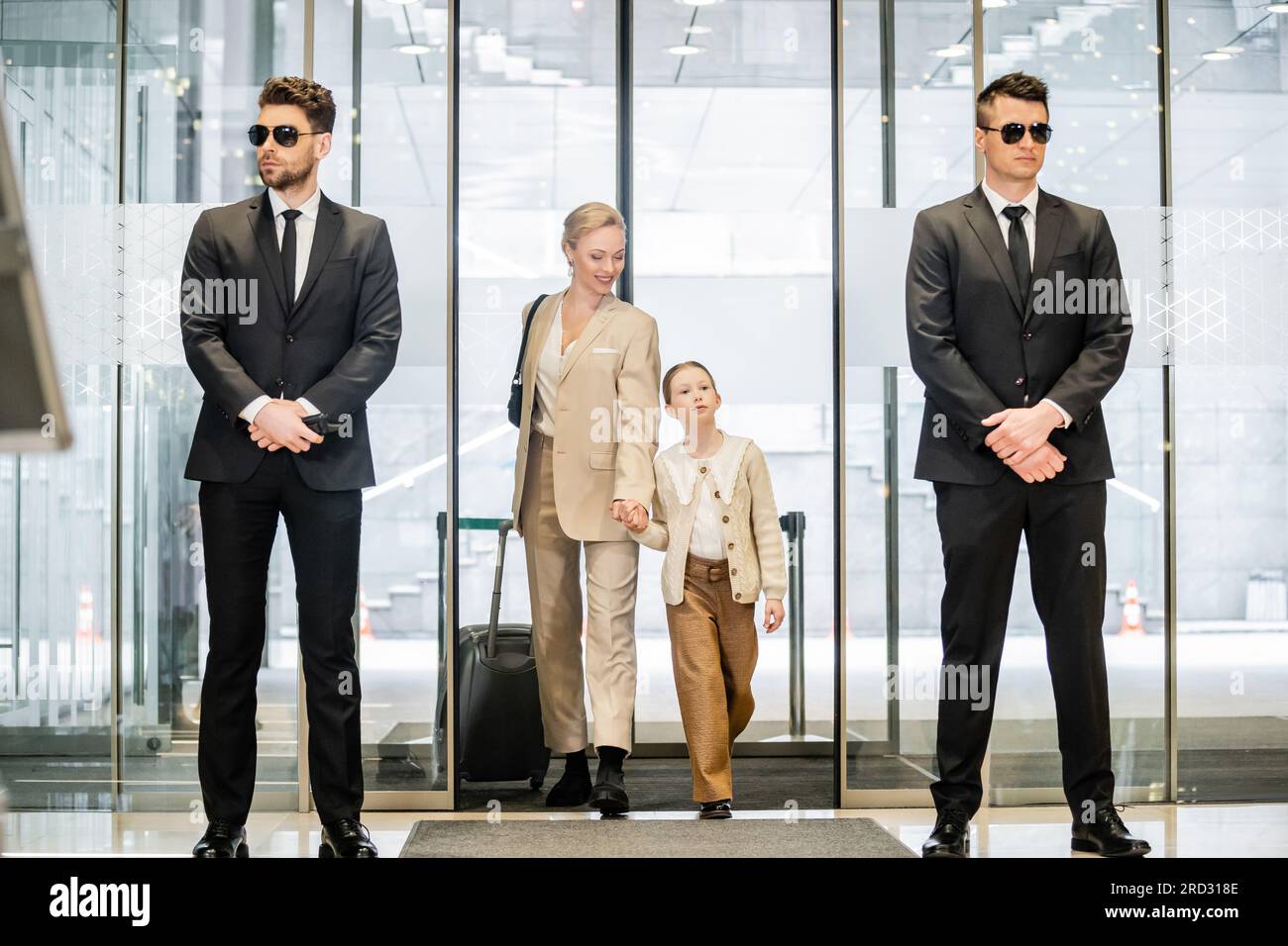 private security concept, two bodyguards in formal wear and sunglasses