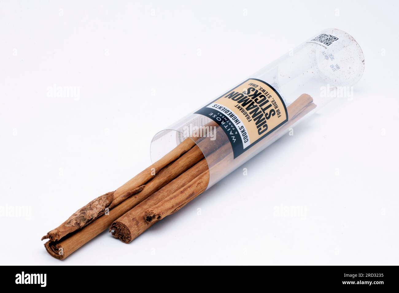 Tube of Cooks Ingredients Dried Cinnamon Sticks Spilling from Container Stock Photo