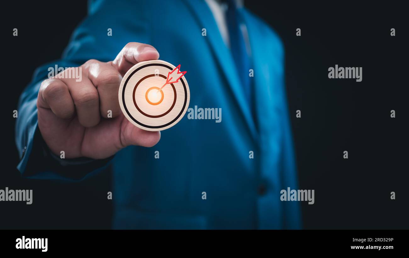 Businessman holding to the target icon . Business concept. management ...