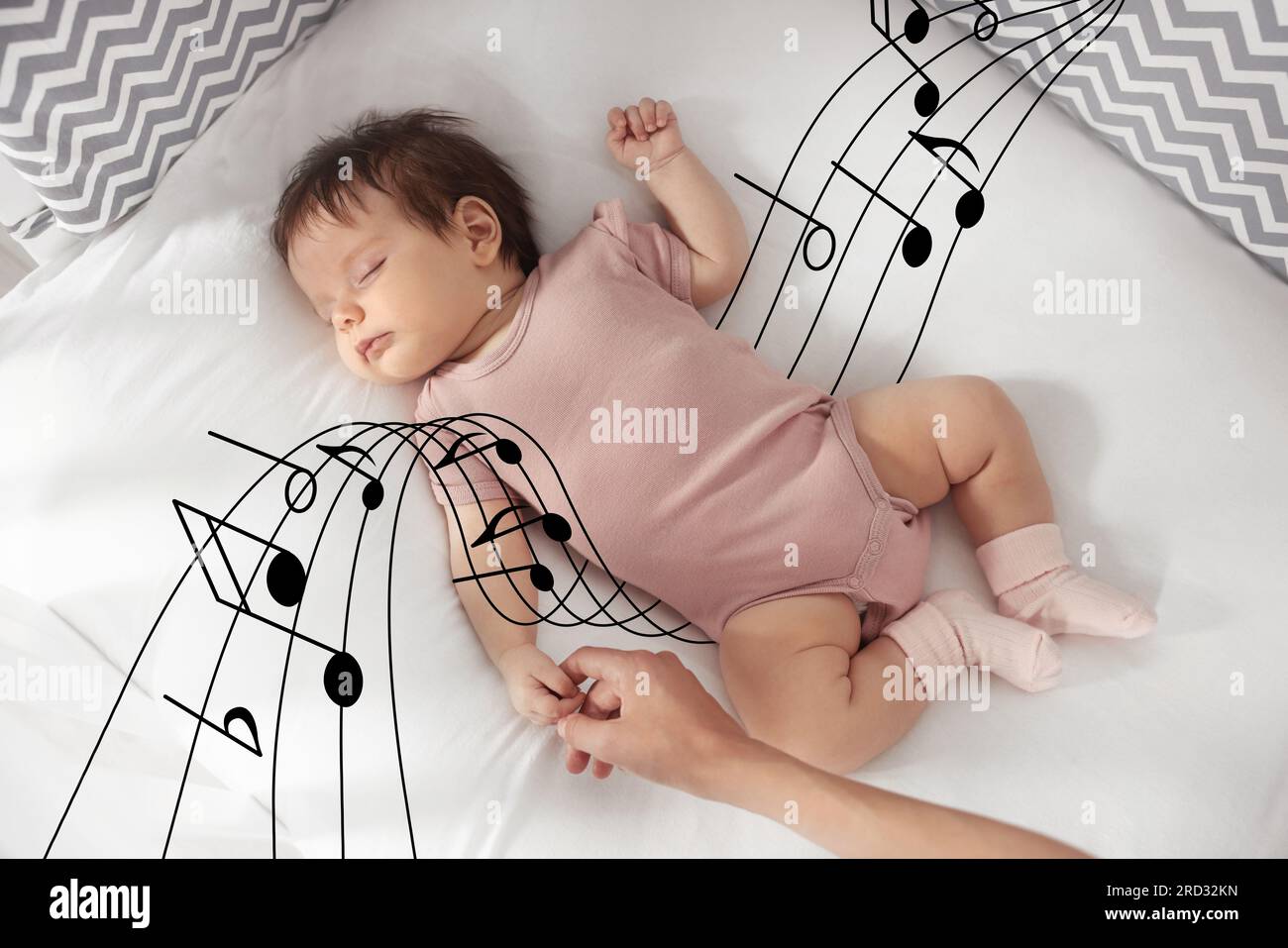 Lullaby songs. Mother holding her sleeping baby's hand on bed, top view. Illustration of flying music notes around child Stock Photo