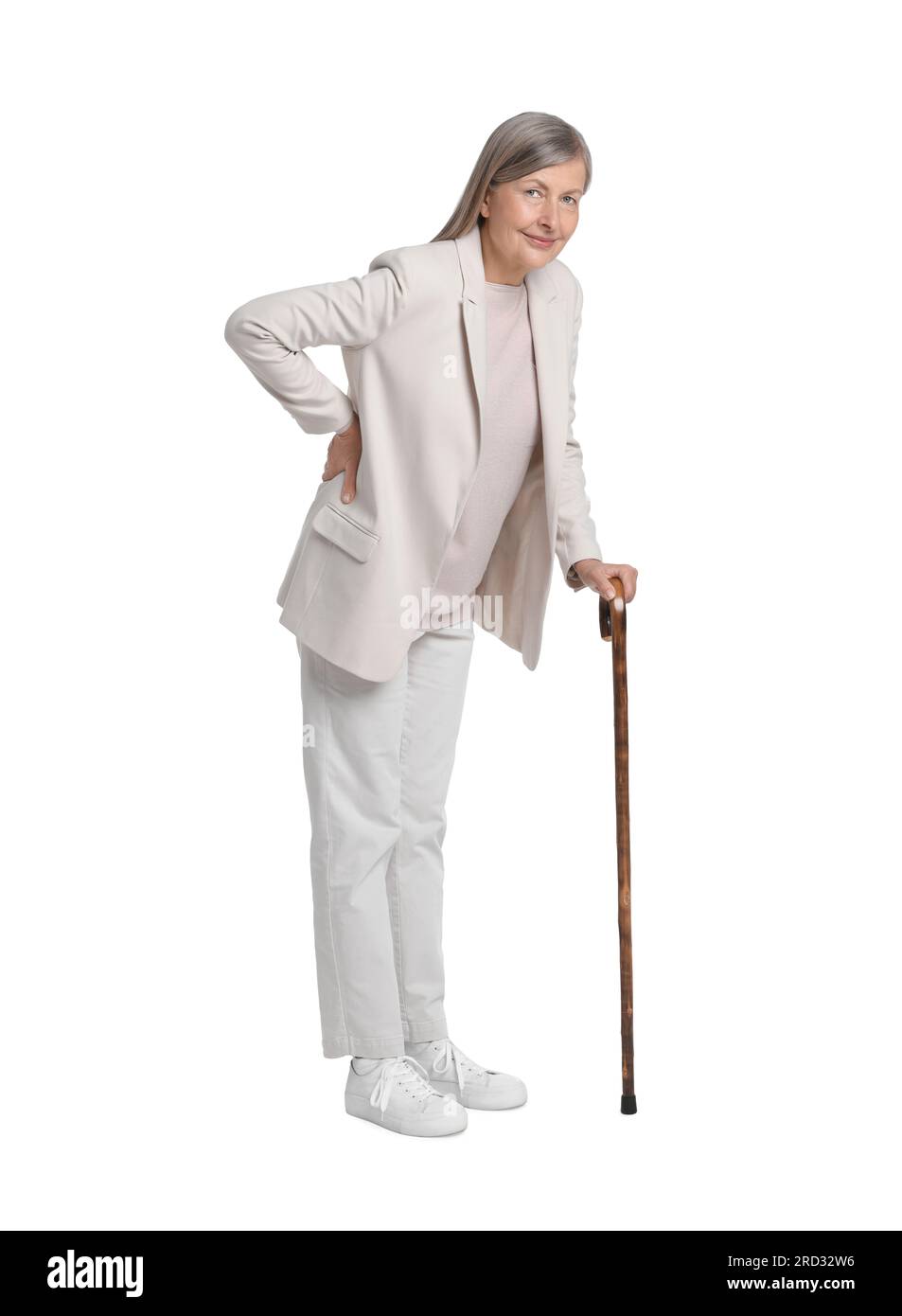 Senior woman with walking cane on white background Stock Photo - Alamy