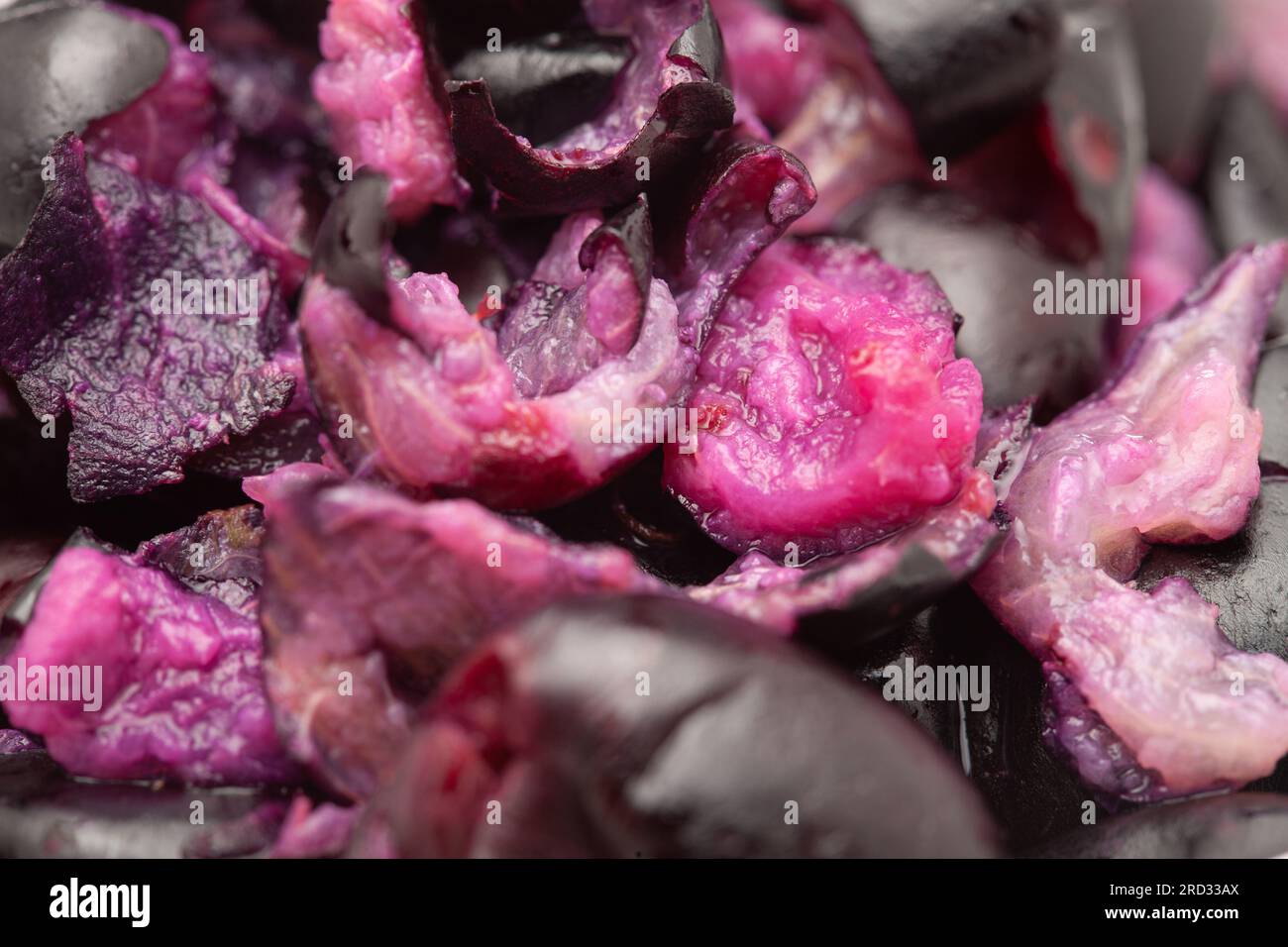 Close-Up of collection of Indian Ayurvedic medicinal fresh organic fruit jamun (Syzygium Cumini) raw pulp or rough pieces Stock Photo