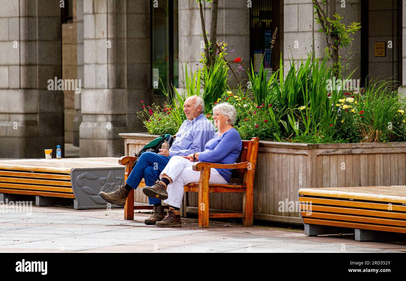 Dundee, Tayside, Scotland, UK. 18th July, 2023. UK Weather: Today's summer day temperature in Tayside, Scotland, reached 22°C. Stylish local residents spend the day in Dundee's city centre, taking advantage of the lovely warm July morning sunshine as well as enjoying town life. Credit: Dundee Photographics/Alamy Live News Stock Photo