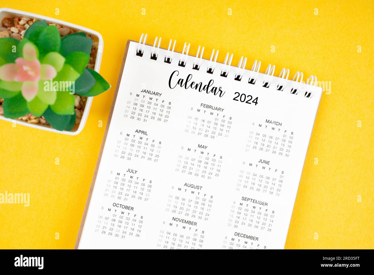 12 months desk calendar 2024 on yellow background Stock Photo Alamy