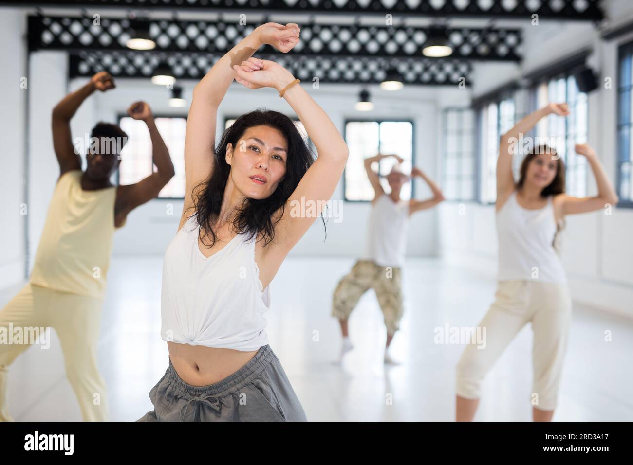 Asian woman studying movement of contemporary dance Stock Photo - Alamy