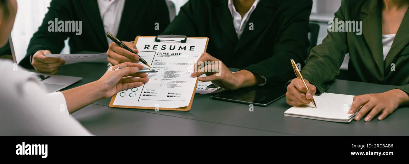 Candidate and interviewers discuss work experience and qualifications