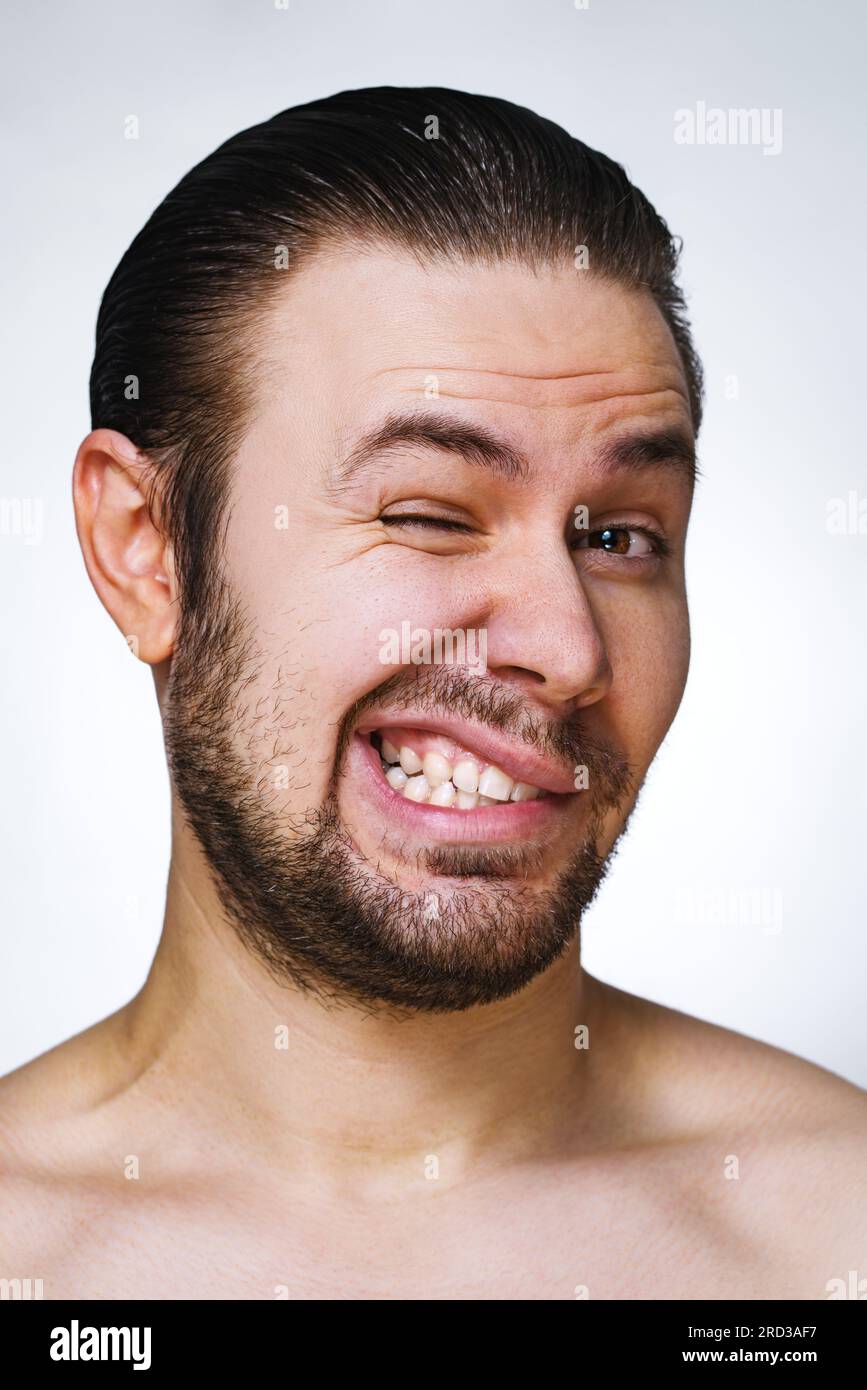 Young man emotional wink portrait Stock Photo