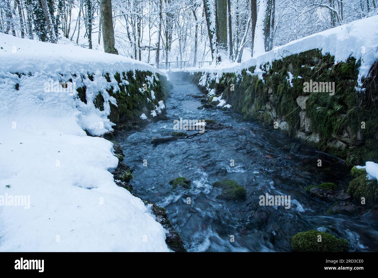 not a frozen river in the snowy forest Stock Photo - Alamy