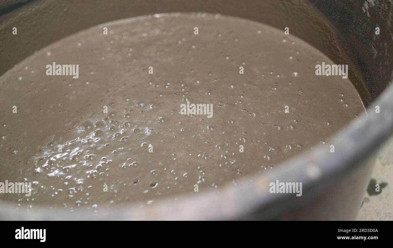 Selflevelling floor compound. Mortar in a bucket, preparation for
