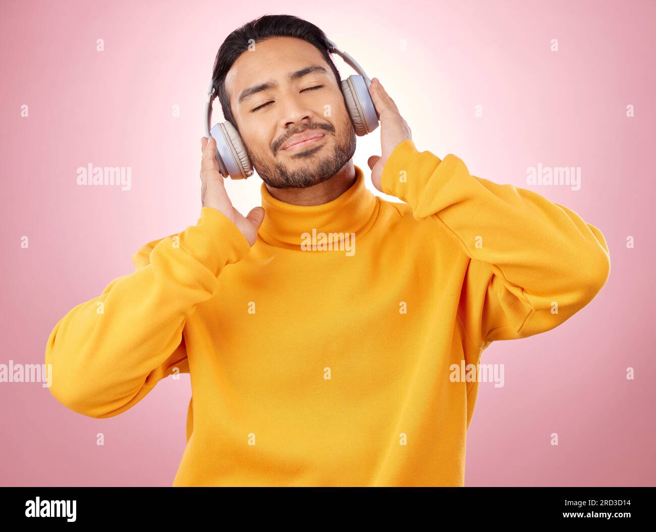 Happy, listening headphones, music and stress relief against a studio background. Male person, and model with headset, streaming Stock Photo - Alamy