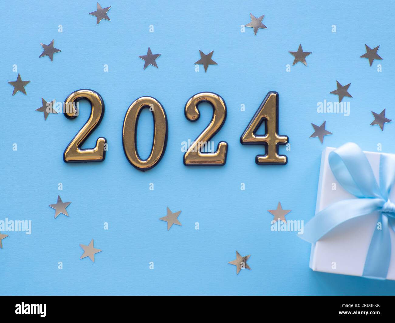 2024 On Blue Background With Gift Box And Silver Stars Stock Photo Alamy   2024 On Blue Background With Gift Box And Silver Stars 2RD3FKK 