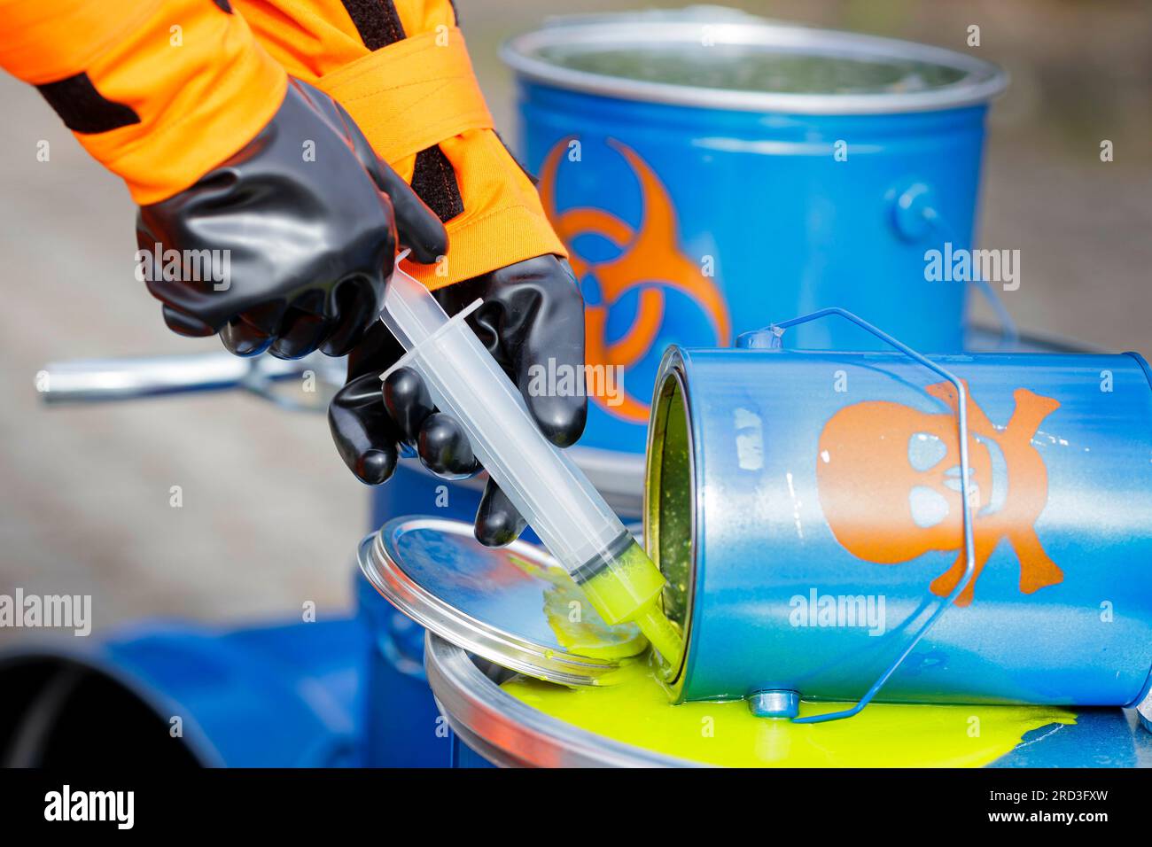 People in CBRN personal protective equipment, chemical, biological, radiological and nuclear hazard, check a liquid that may be toxic at the Federal Office for Civil Protection and Disaster Assistance, Bonn, July 18, 2023. Stock Photo